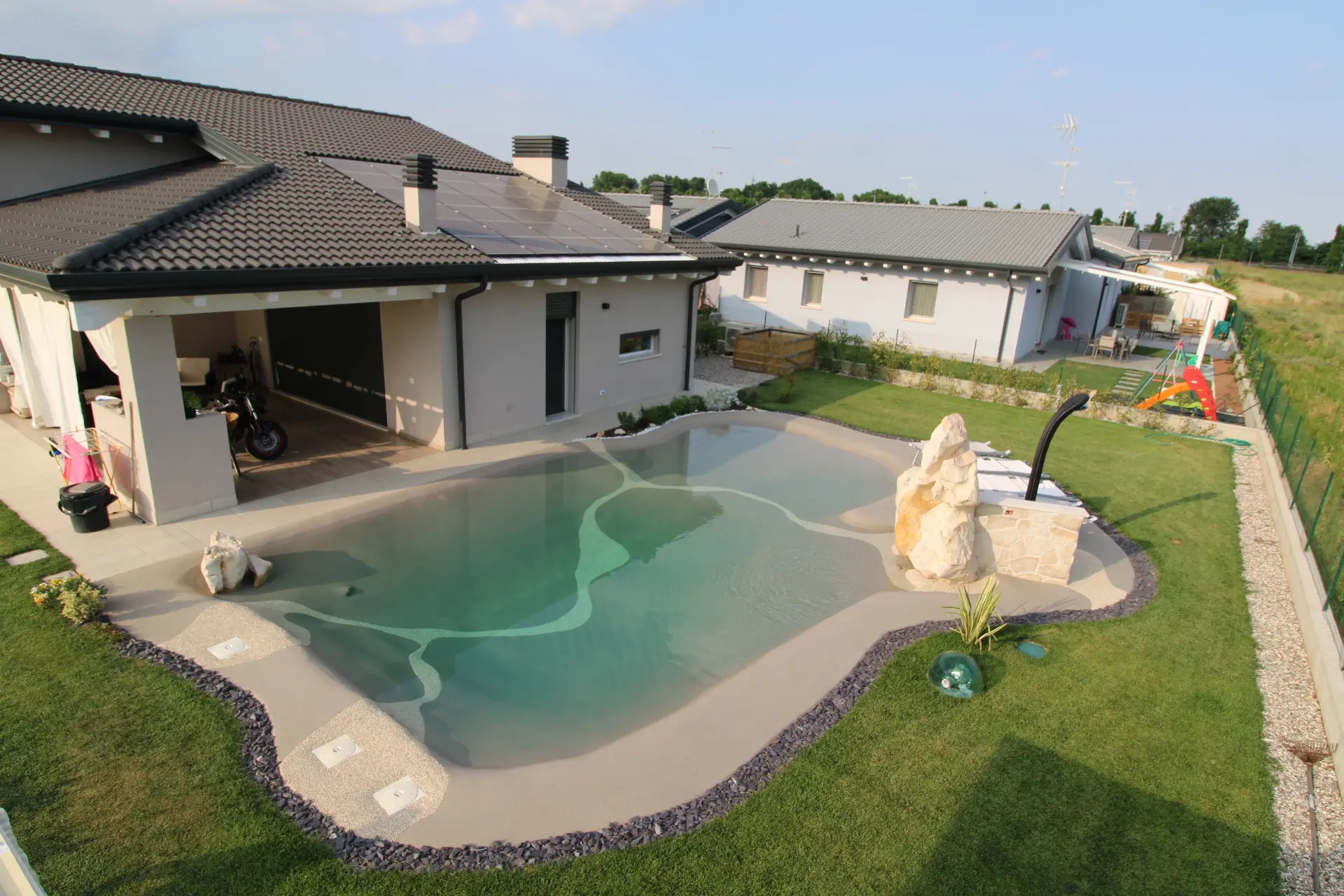 Naturi hand-troweled beach entry sand pool