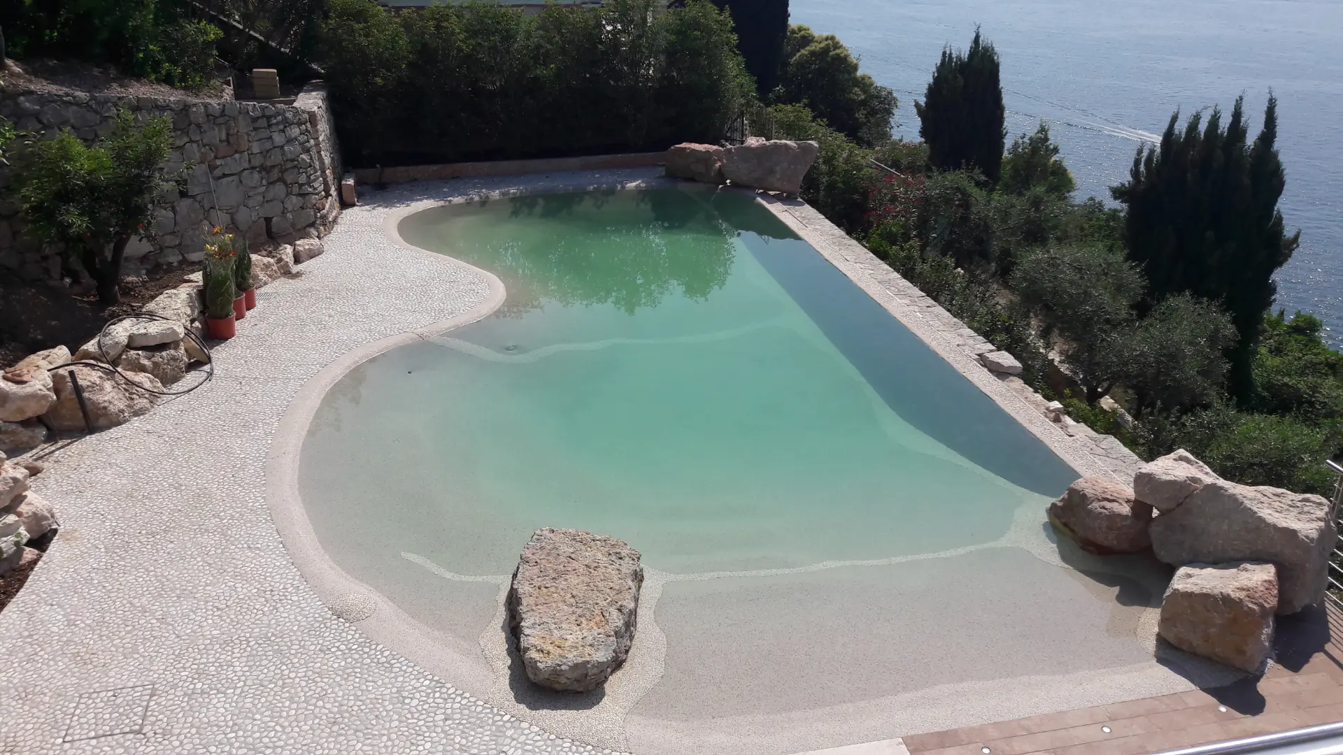 Naturi hand-troweled beach entry sand pool